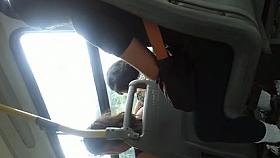 Beautiful brunette with gym pants on the bus