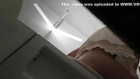 Cute girl makes a selfie on the toilet