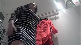 Peeping a girl in thong trying out clothes