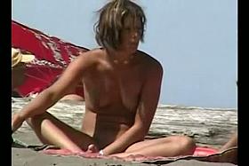 Jiggling tits and round asses on the nude beach candid voyeur videos