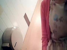 Girl in dress and ponytail pissing