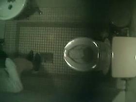 Asian girls go pissing under a bathroom spy camera