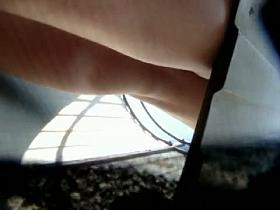 Hot legs and pantieless view of girl in beach change cabin