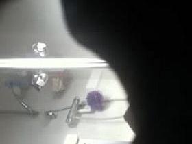 Rear view when she is brushing her teeth