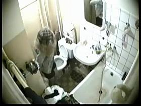 Blonde was caught in the intimate moment of peeing on toilet