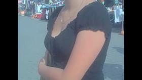 Look down the blouse of the amateur in the street