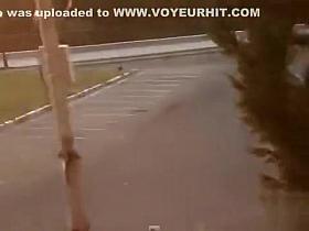 Unaware cutie pisses on the parking lot