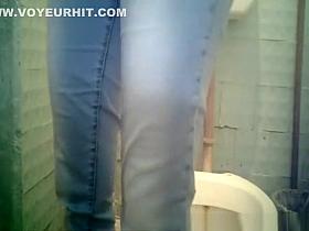 Small bush woman peeing in toilet