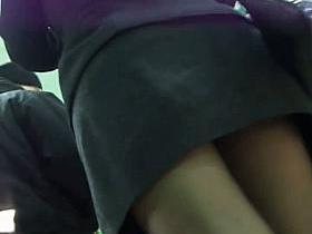 Hot redhead spied on by an up skirt perv