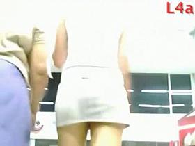 Looking up the skirt of a bubble butt brunette