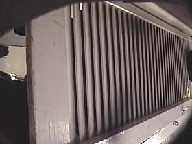 Man with cam trying to see something in change room