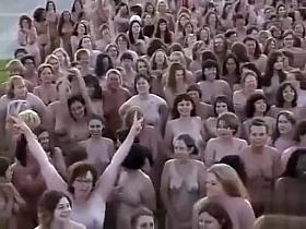 Hundreds of nudists strip for a camera man