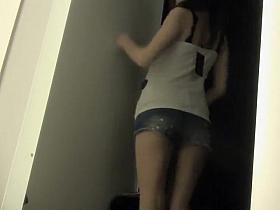 Posing in the fitting room mirror