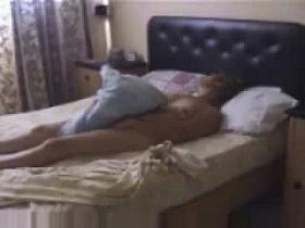 Hidden cam catches my mum masturbating on bed