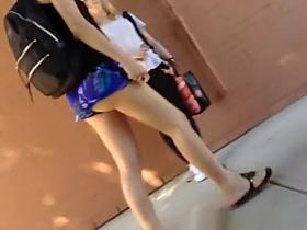 Girl walking in street butt cheeks