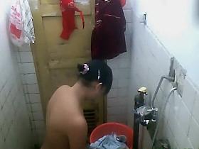 She removes costume and showers