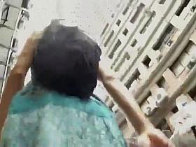 Girl walking on the street in a short skirt