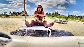 Chubby MILF applies sunscreen to giant melons