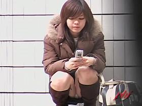 Jazzy teenage Asian chick is the main target of some voyeur sharking chap