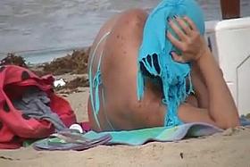 two mature in thong on the beach