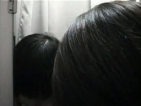 Asian trying on fake big tits on changing room hidden camera