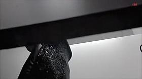 Girl in changing room in black bra and red hot panty