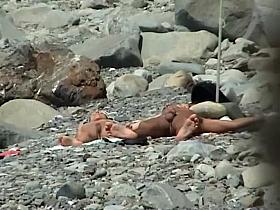 Guy reached for her ass while they tan