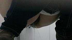 Cute skinny girl is taking a piss in the toilet with a spy cam