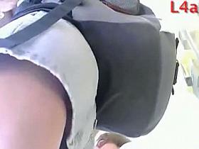 Amazing blonde babe in sunglasses wears a jeans skirt