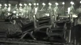 Voyeur films couples at night on a beach