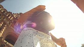 A couple of ladies are in an upskirt porno where their asses are shown