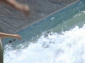 Guys are filming some girls on the beach