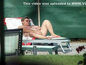 Milf thinks she's all alone at a pool