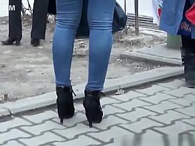 Chick in high heels and tight jeans pants