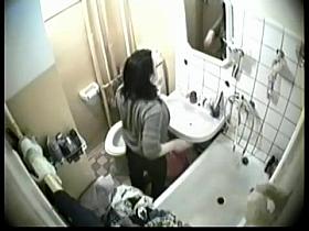 Real babe pissed and looked into mirror on hidden cam