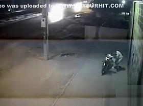 Female motorcyclist gets caught on security cam urinating