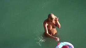 Big topless natural breasts on beach