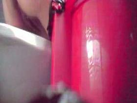 Close distance toilet spy cam of a woman pissing