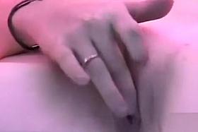 Cute blonde stimulates her pussy in the tanning bed