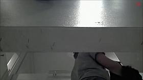 Sexy doll in erotic brassiere changing top in fitting room