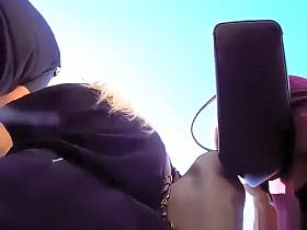 Pussy lips under her short skirt.