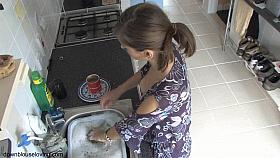 Beauty exposed in down blouse video while doing the dishes