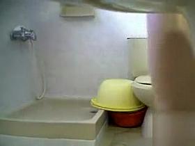 This girl is caught in the bathroom on hidden cam