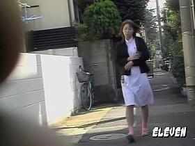 Skirt sharking of an attractive red haired Asian chick