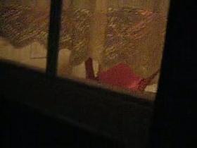 A woman is beeing watched peeing in her private toilet