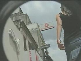 Upskirt action with a tall slender babe wearing a pleated short skirt