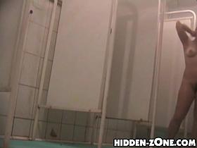 Shower spy cam amateur exposes tits and hairy cunt