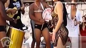 Hot Latina chicks dancing at a beach party