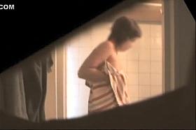 Busty aunt secretly filmed in the bathroom