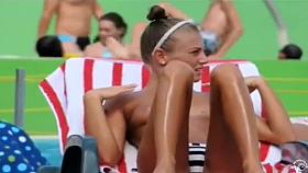 Topless skinny girl looks sexy at the water park